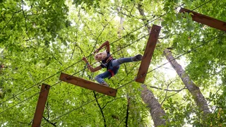 Child in the climbing forest near the Plansee