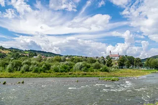 River landscape with castle in Poland